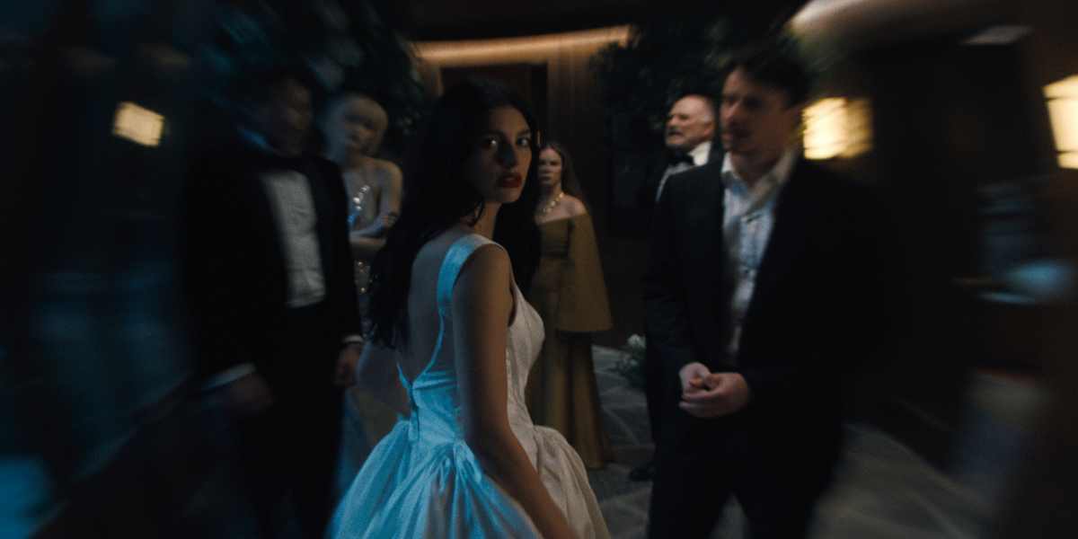 Something Very Bad Is Going To Happen. (L to R) Jeff Wilbusch as Jules, Gus Birney as Portia, Camila Morrone as Rachel Harkin, Jennifer Jason Leigh as Victoria, Ted Levine as Boris, Adam DiMarco as Nicky Cunningham in episode 108 of Something Very Bad Is Going To Happen. Cr. Courtesy of Netflix © 2026