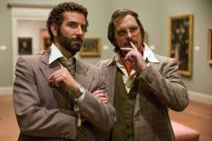 Bradley Cooper e Christian Bale in American Hustle (2013)