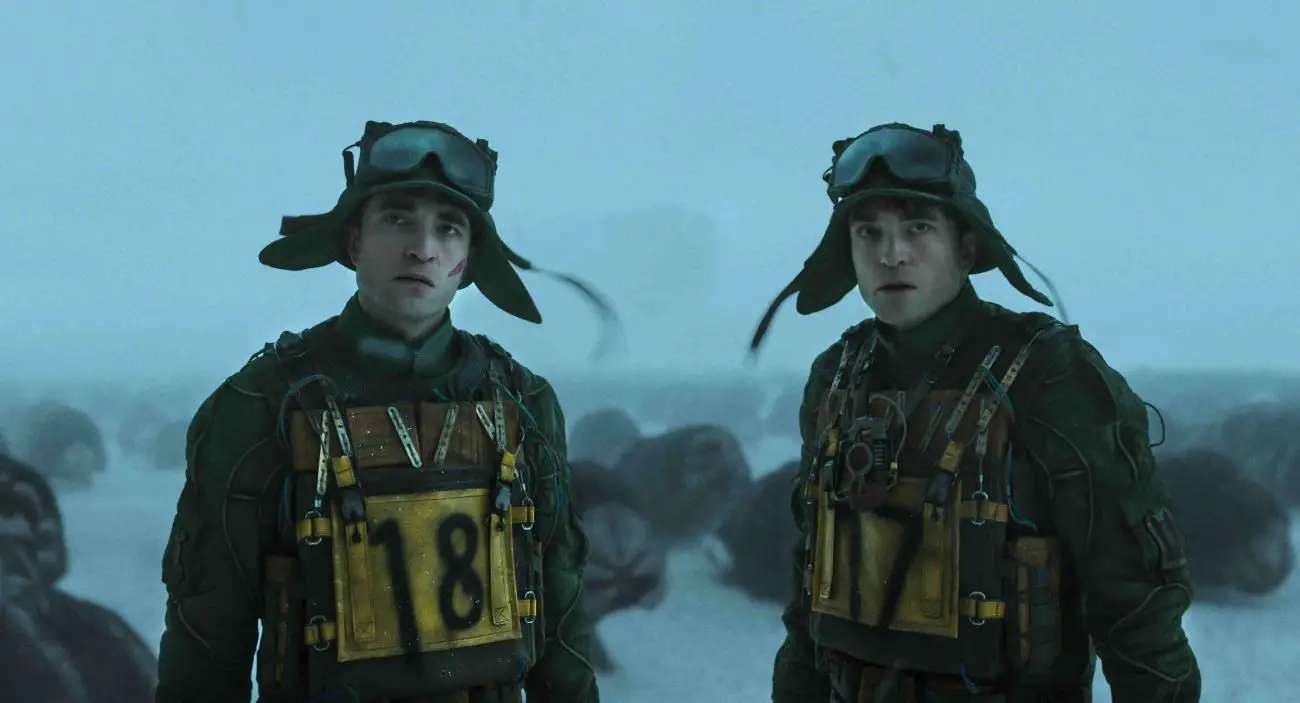 (L to r) ROBERT PATTINSON as Mickey 18 and ROBERT PATTINSON as Mickey 17 in “MICKEY 17,” a Warner Bros. Pictures release. Copyright © 2024 Warner Bros. Entertainment Inc. All Rights Reserved Photo Credit Courtesy of Warner