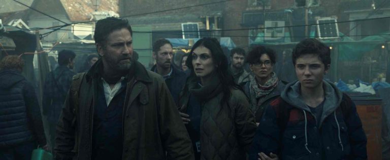 Gerard Butler as John Garrity, Morena Baccarin as Allison Garrity, Amber Rose Revah as Dr. Casey Amina, and Roman Griffin Davis as Nathan Garrity in Greenland 2: Migration. Photo Credit: Courtesy of Lionsgate
